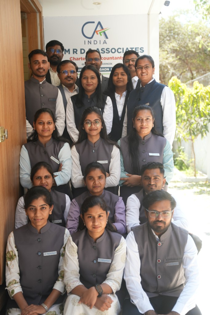 SKMRD & Associates Chartered Accountants — full team at office entrance